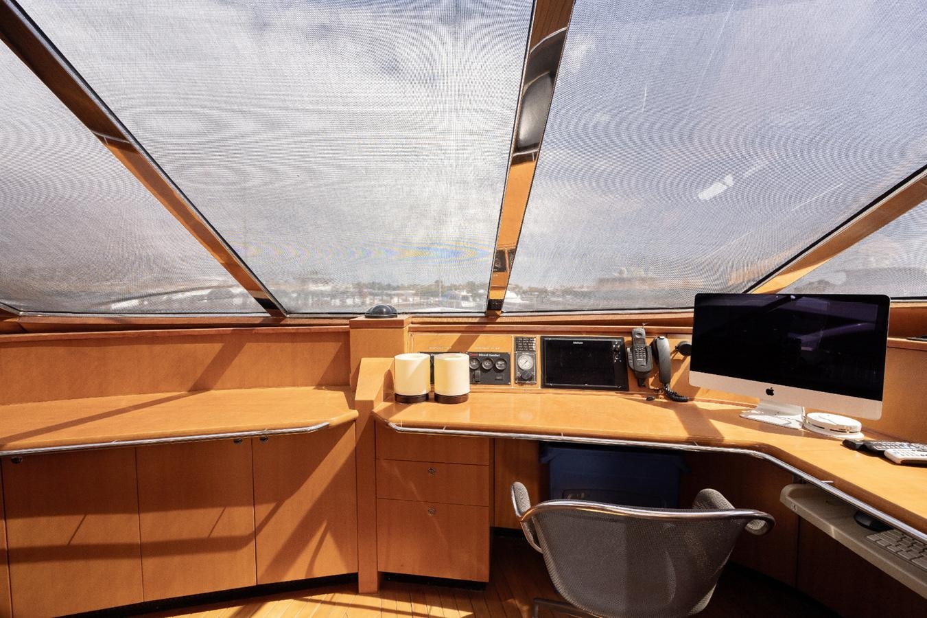 a room with a desk and computer aboard CINNABAR VI Yacht for Sale