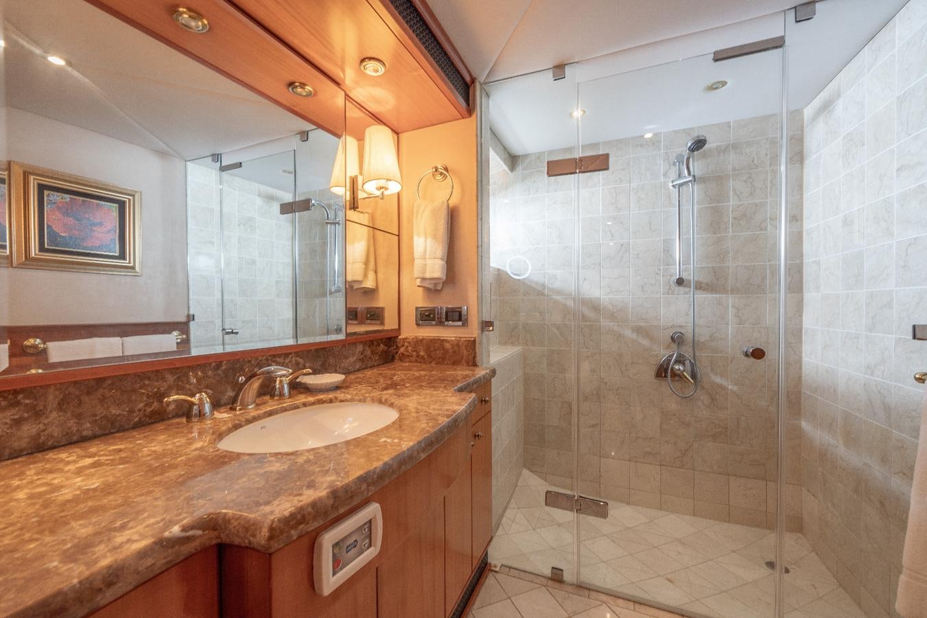 a bathroom with a marble countertop aboard CINNABAR VI Yacht for Sale