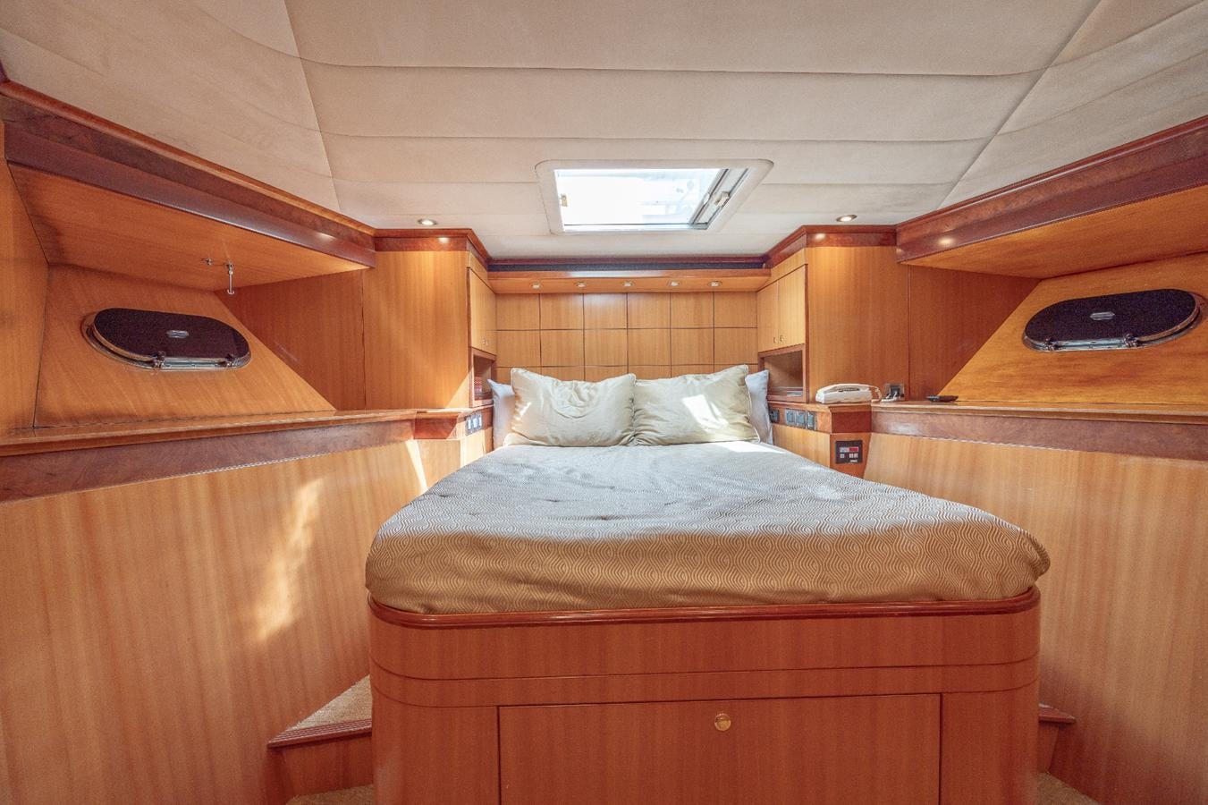 a bed in a cabin aboard CINNABAR VI Yacht for Sale