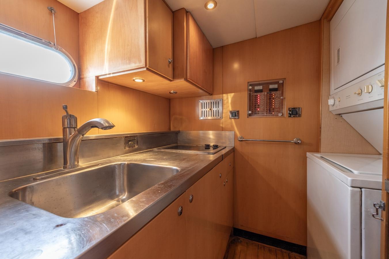 a kitchen with a sink and cabinets aboard CINNABAR VI Yacht for Sale