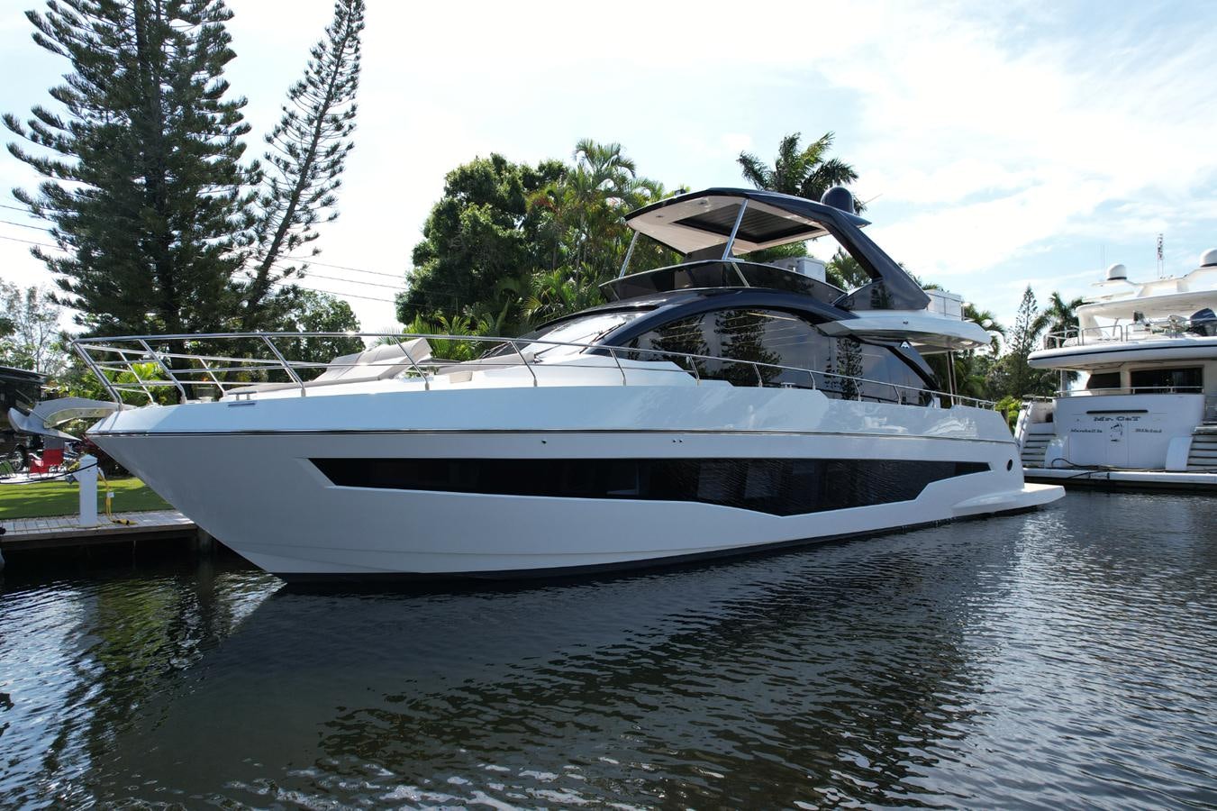 a white boat on a body of water aboard 2024 ASTONDOA 66 FLYBRIDGE Yacht for Sale