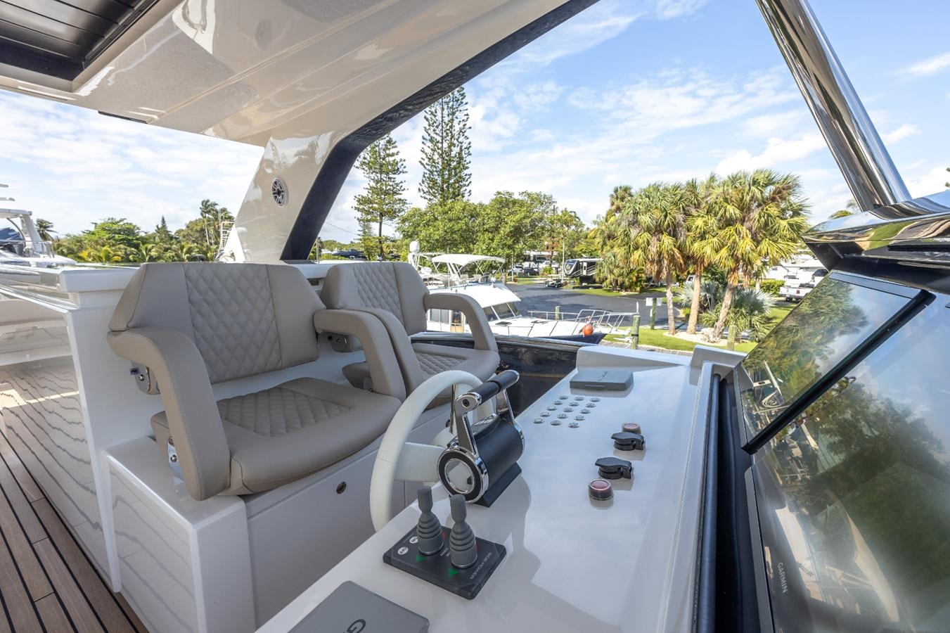 a car with a view of trees and grass aboard 2024 ASTONDOA 66 FLYBRIDGE Yacht for Sale