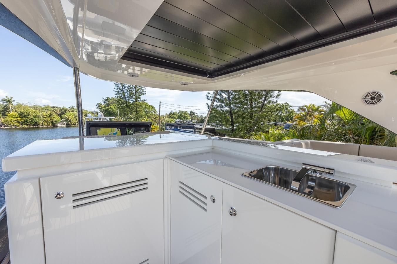 a white kitchen with a large window aboard 2024 ASTONDOA 66 FLYBRIDGE Yacht for Sale
