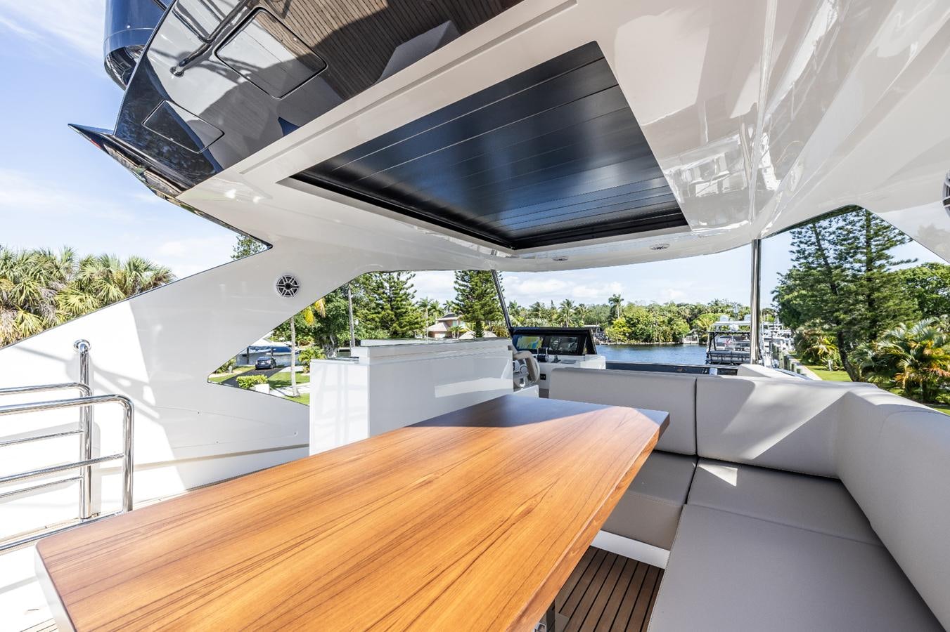 a large white roof with a black roof and a wood table aboard 2024 ASTONDOA 66 FLYBRIDGE Yacht for Sale