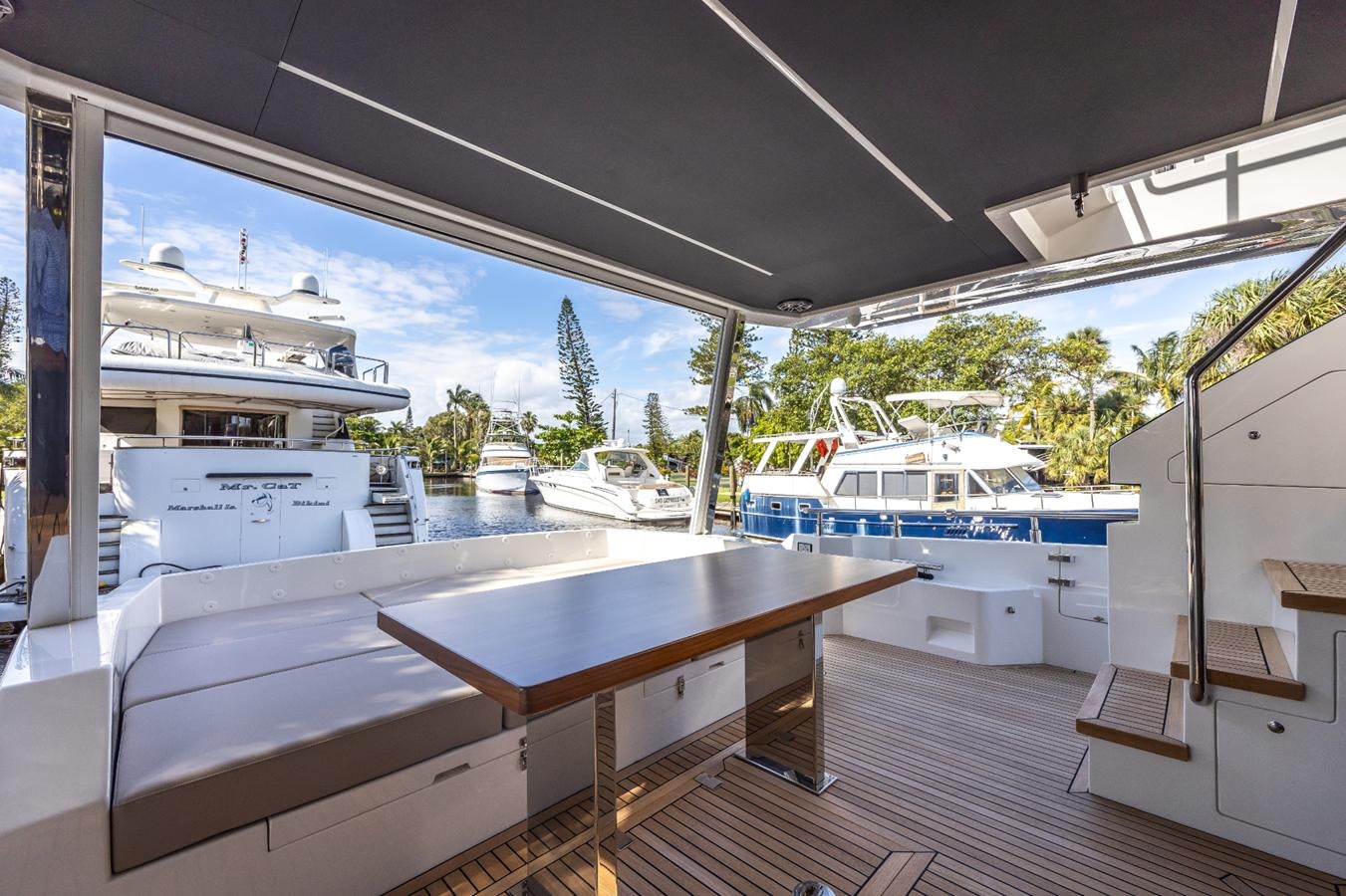 a room with a table and chairs aboard 2024 ASTONDOA 66 FLYBRIDGE Yacht for Sale