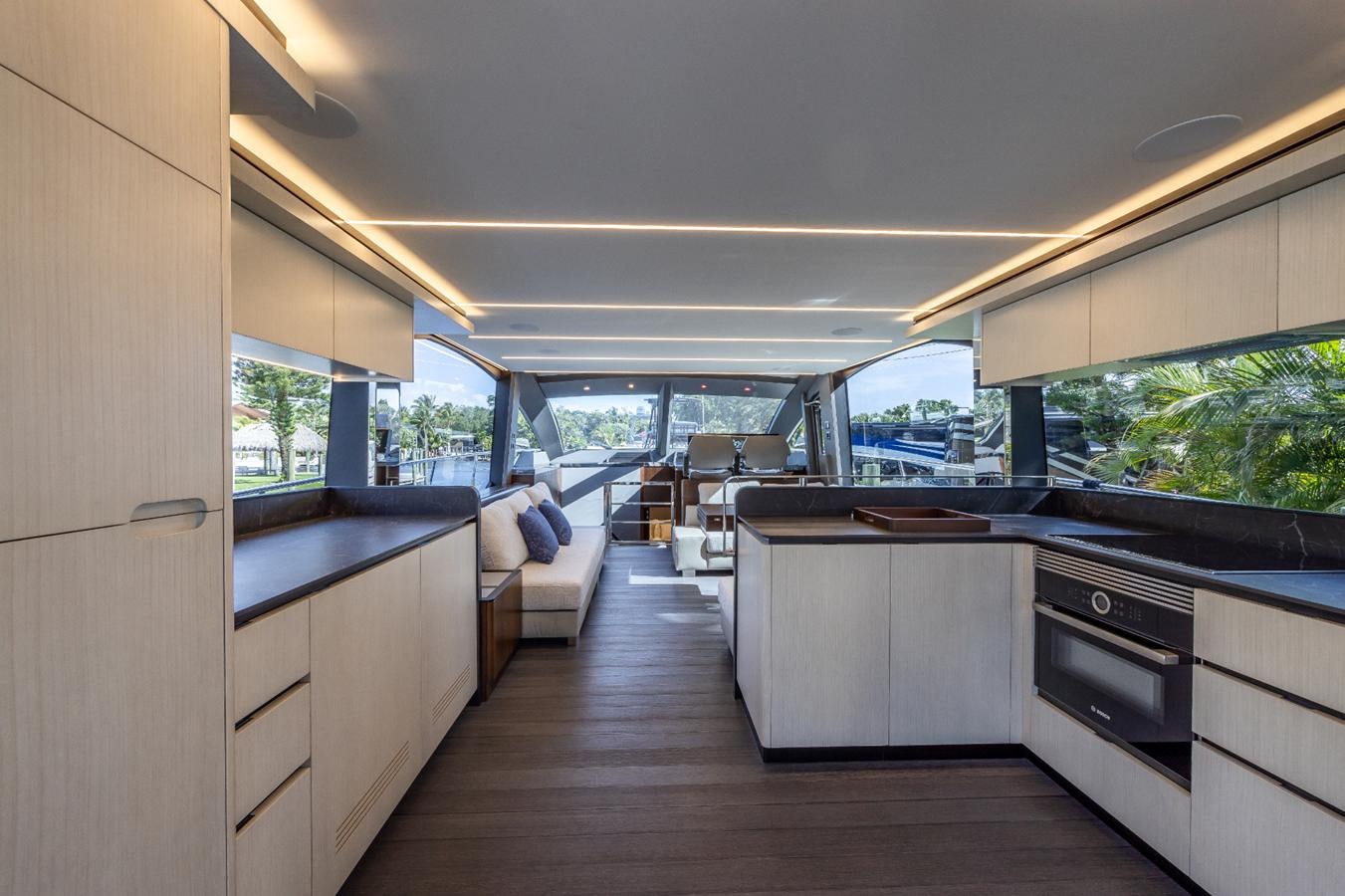 a kitchen with a large window aboard 2024 ASTONDOA 66 FLYBRIDGE Yacht for Sale