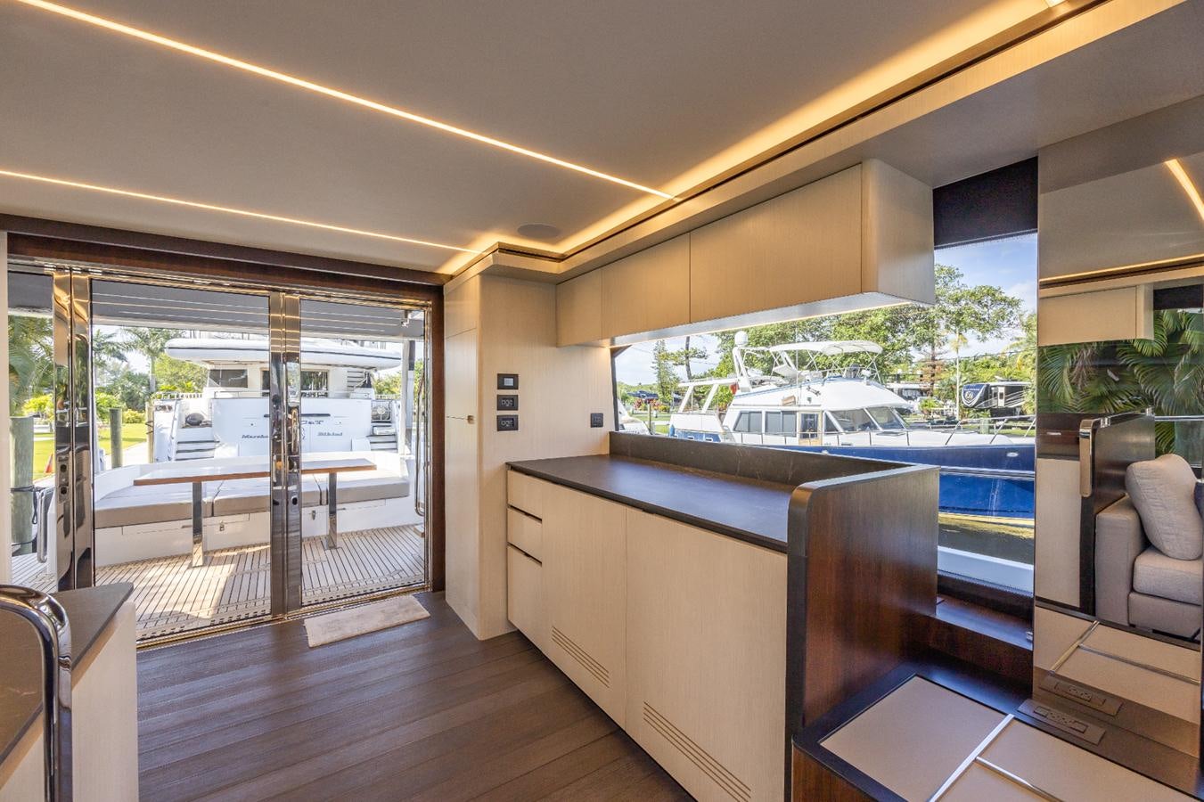 a room with a view of a city and a large window aboard 2024 ASTONDOA 66 FLYBRIDGE Yacht for Sale