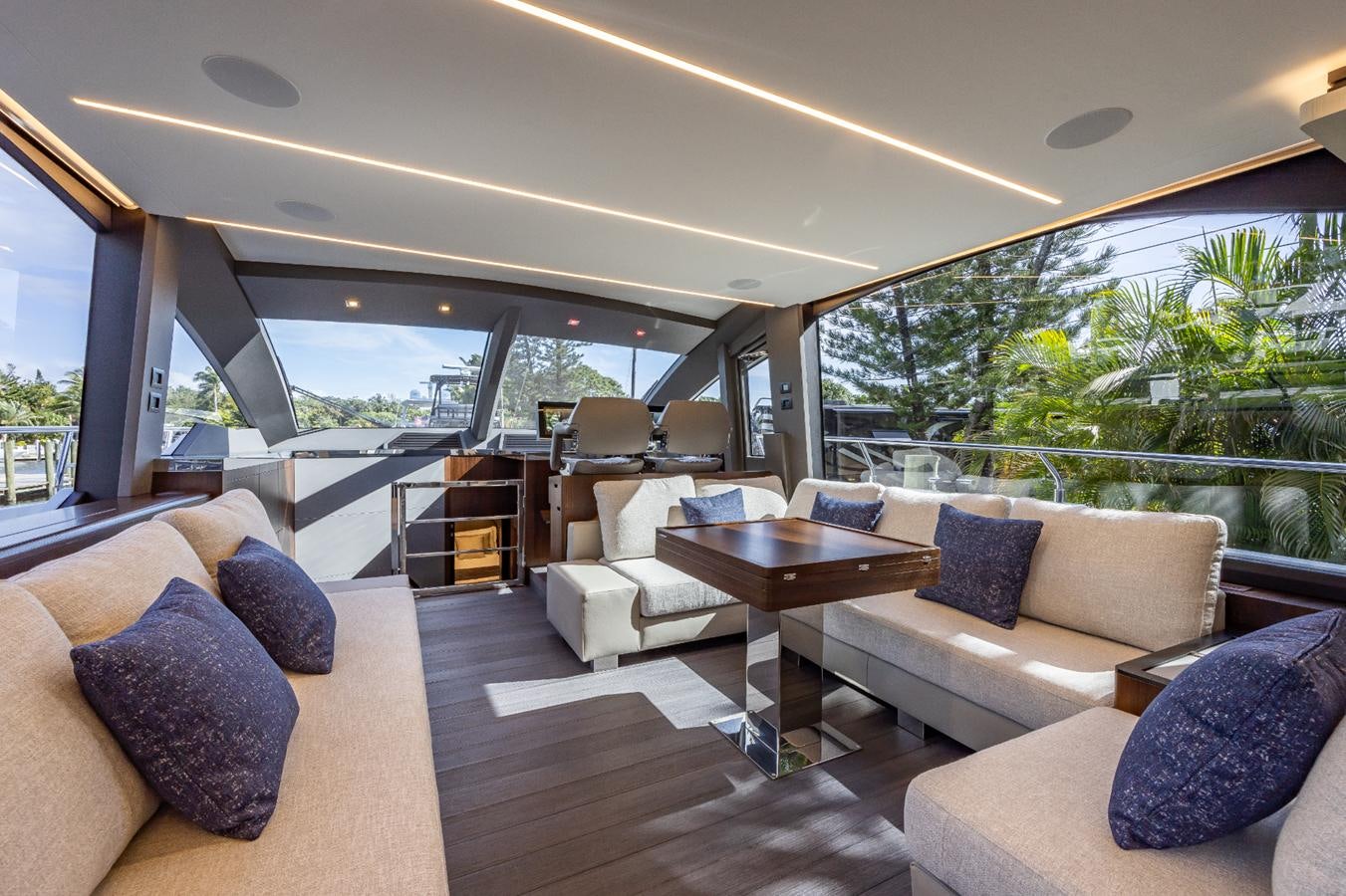 a living room with a large window aboard 2024 ASTONDOA 66 FLYBRIDGE Yacht for Sale