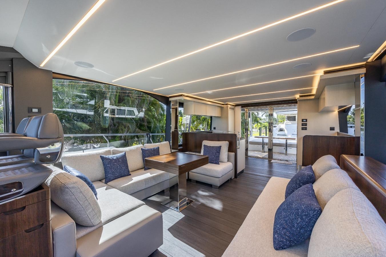 a living room with a couch and a table aboard 2024 ASTONDOA 66 FLYBRIDGE Yacht for Sale
