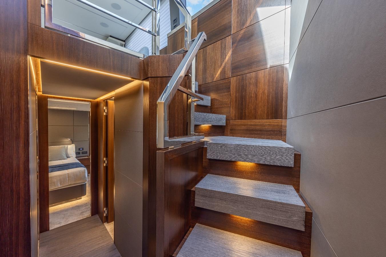 a wooden staircase in a room aboard 2024 ASTONDOA 66 FLYBRIDGE Yacht for Sale