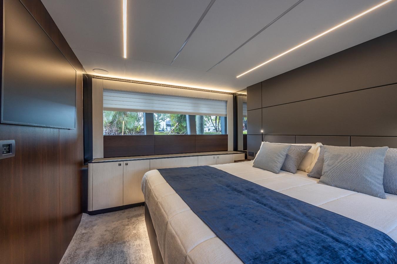 a room with a bed and a window aboard 2024 ASTONDOA 66 FLYBRIDGE Yacht for Sale