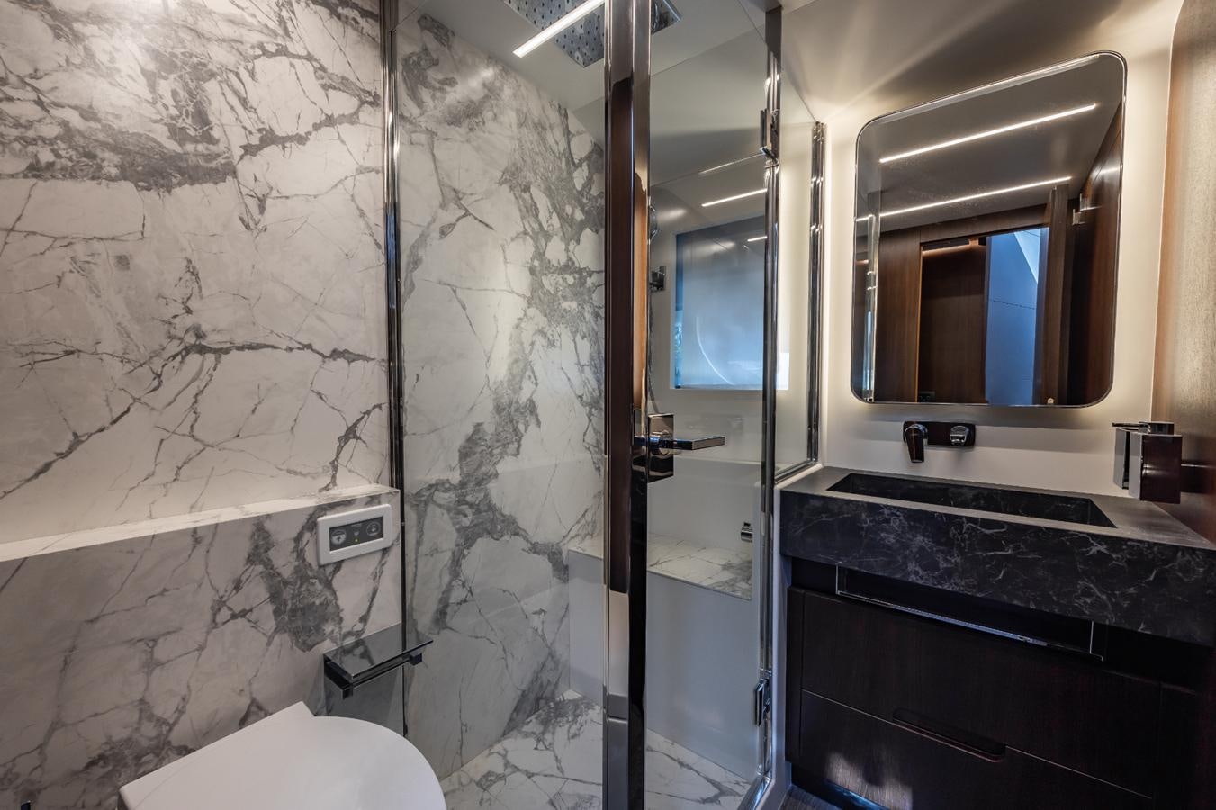 a bathroom with a glass shower aboard 2024 ASTONDOA 66 FLYBRIDGE Yacht for Sale