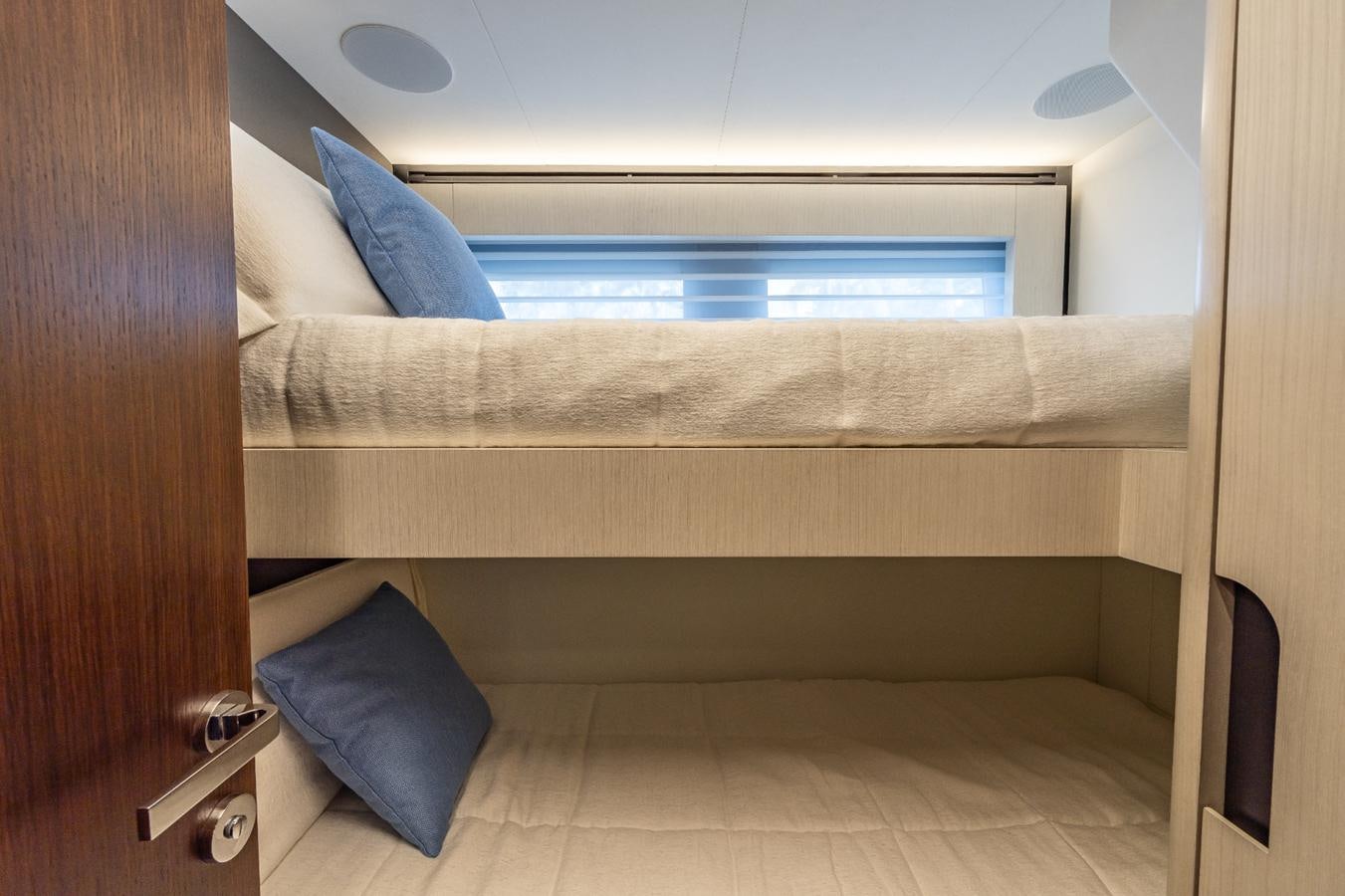 a bed with a blue pillow aboard 2024 ASTONDOA 66 FLYBRIDGE Yacht for Sale