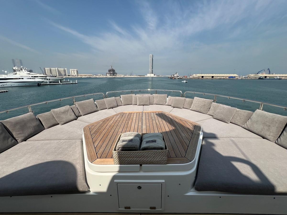 a laptop on a chair on a deck overlooking a body of water aboard 2007 SUNSEEKER 37M Yacht for Sale