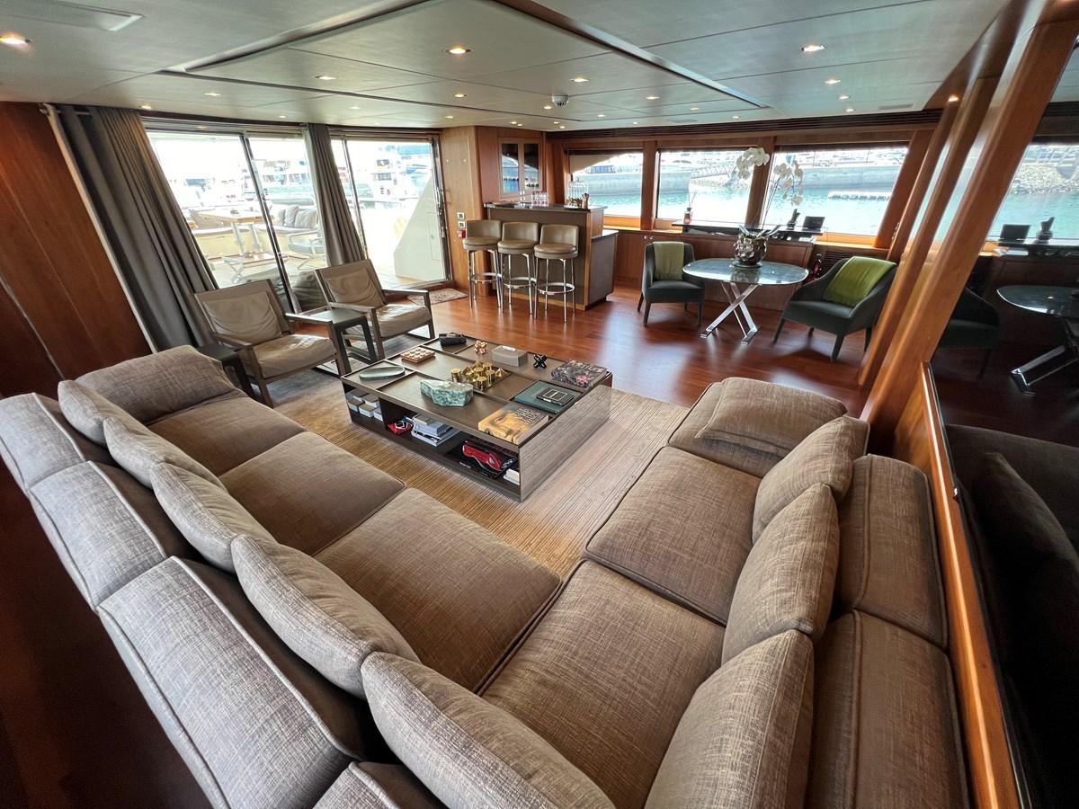 a living room with a large window aboard 2007 SUNSEEKER 37M Yacht for Sale