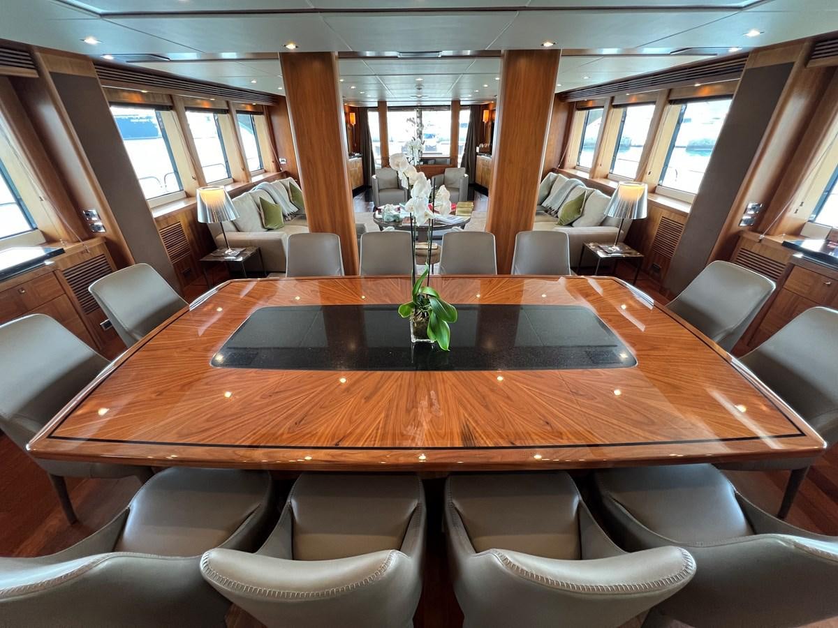 a large room with a table and chairs aboard 2007 SUNSEEKER 37M Yacht for Sale