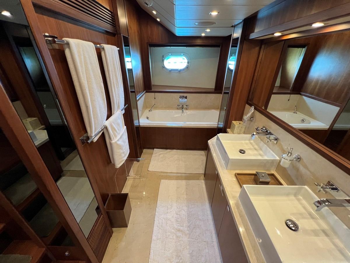 a bathroom with a large mirror aboard 2007 SUNSEEKER 37M Yacht for Sale