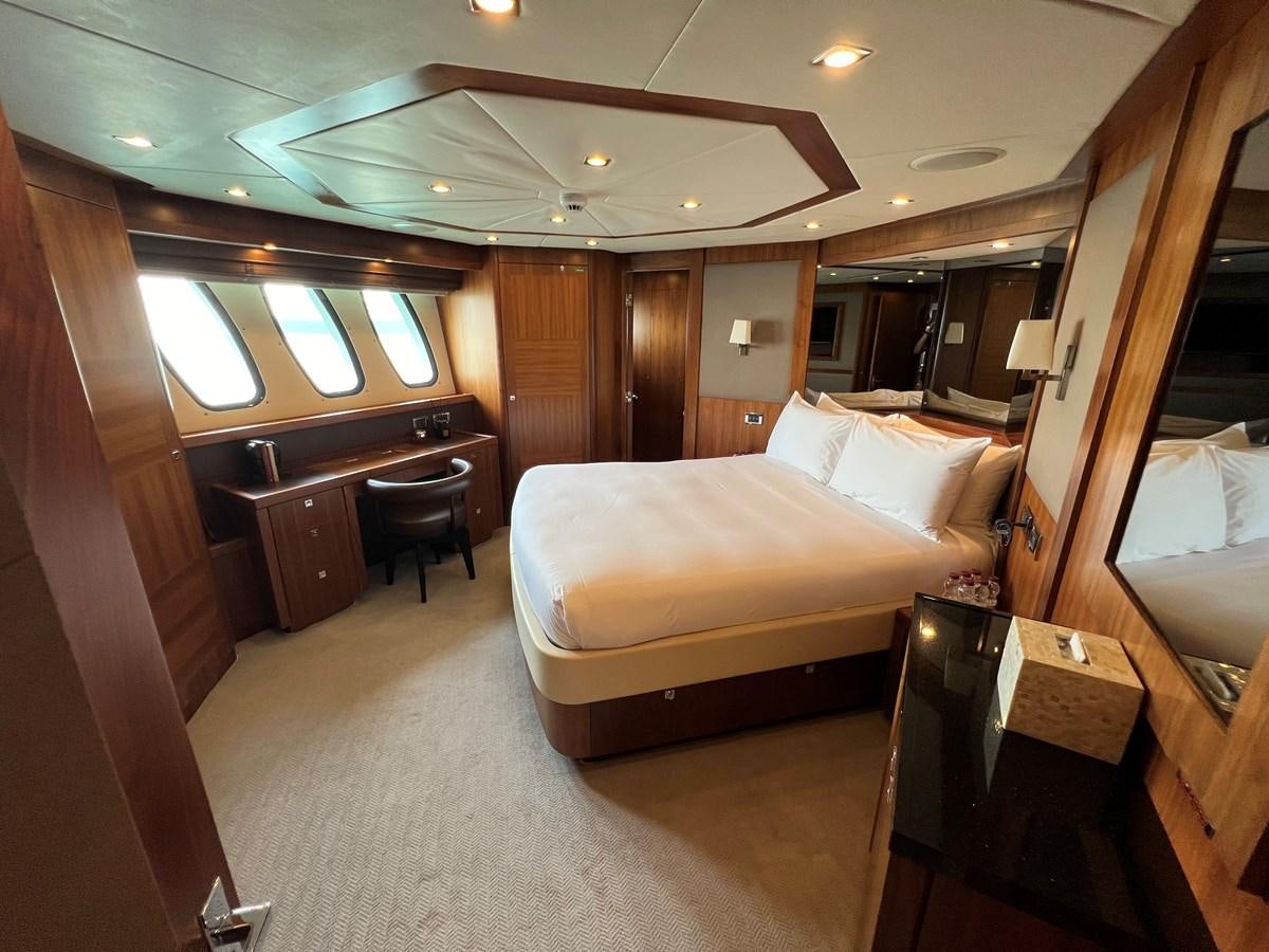 a hotel room with a bed and desk aboard 2007 SUNSEEKER 37M Yacht for Sale