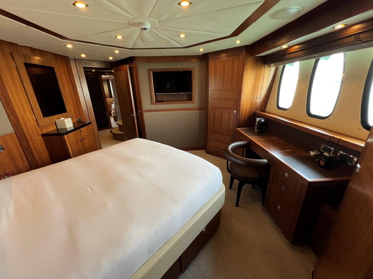 a hotel room with a bed and desk aboard 2007 SUNSEEKER 37M Yacht for Sale