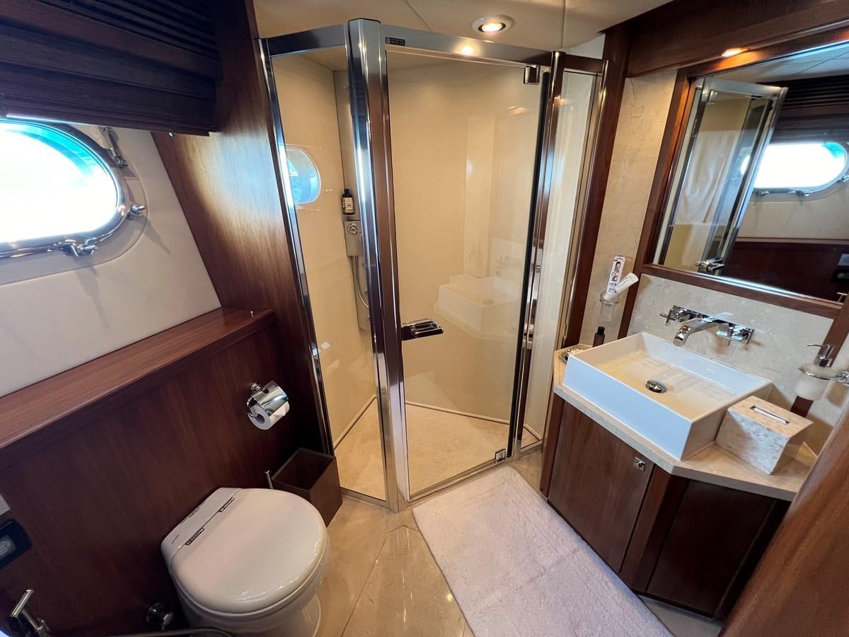 a bathroom with a stand up shower aboard 2007 SUNSEEKER 37M Yacht for Sale