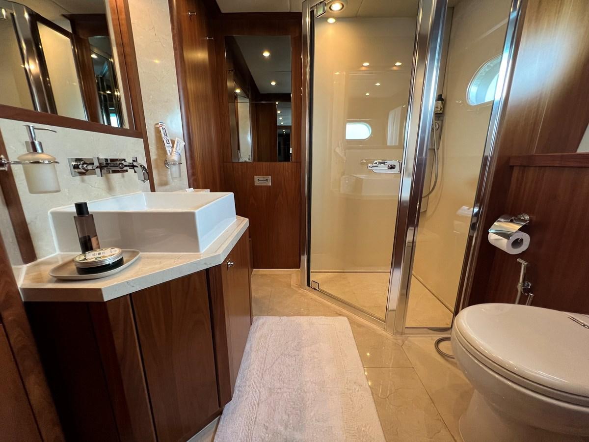 a bathroom with a sink and a shower aboard 2007 SUNSEEKER 37M Yacht for Sale