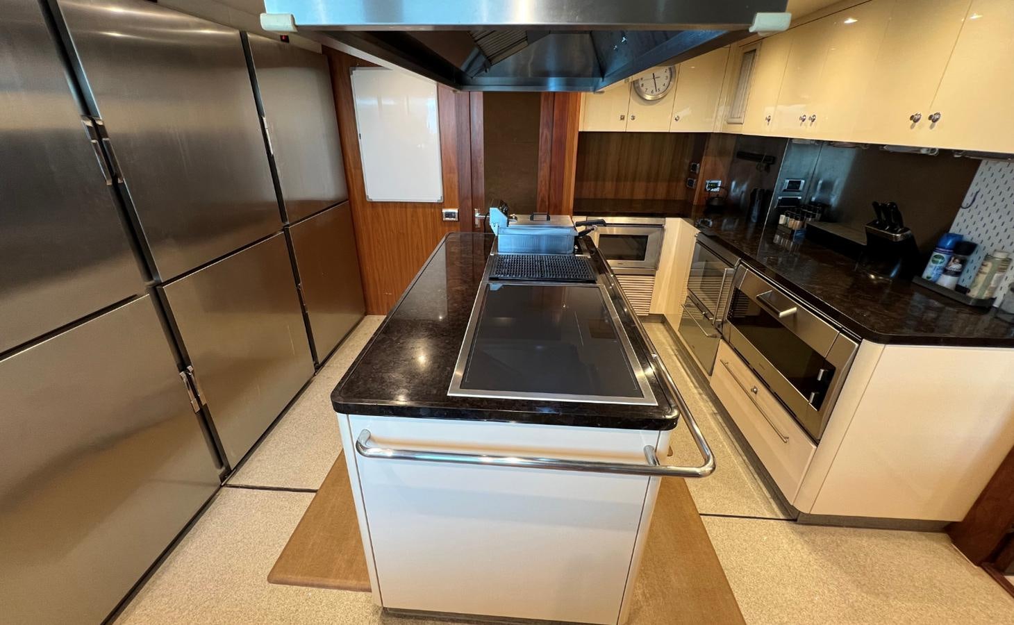 a kitchen with a stainless steel refrigerator aboard 2007 SUNSEEKER 37M Yacht for Sale