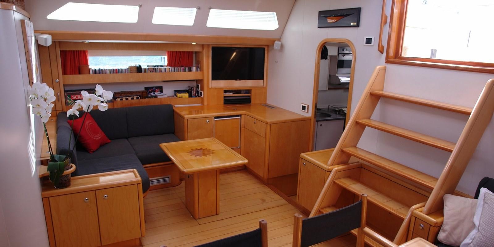 a living room with a couch and a tv aboard DJANGO TOO Yacht for Sale