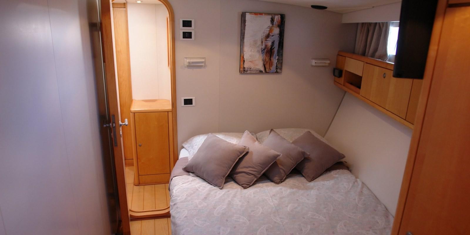 a bed with pillows aboard DJANGO TOO Yacht for Sale