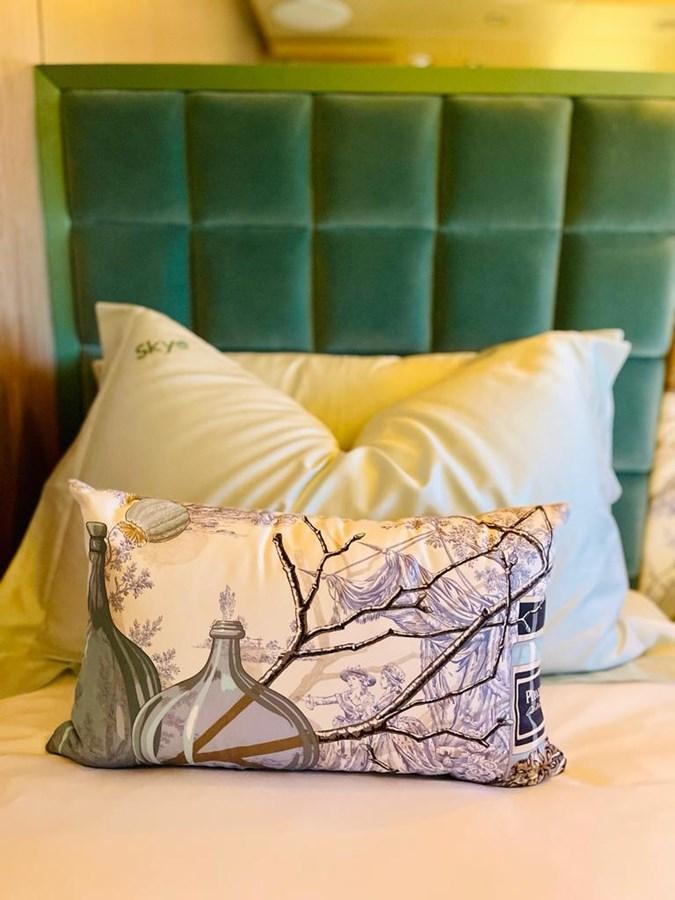 a pillow on a bed aboard SKYE Yacht for Sale
