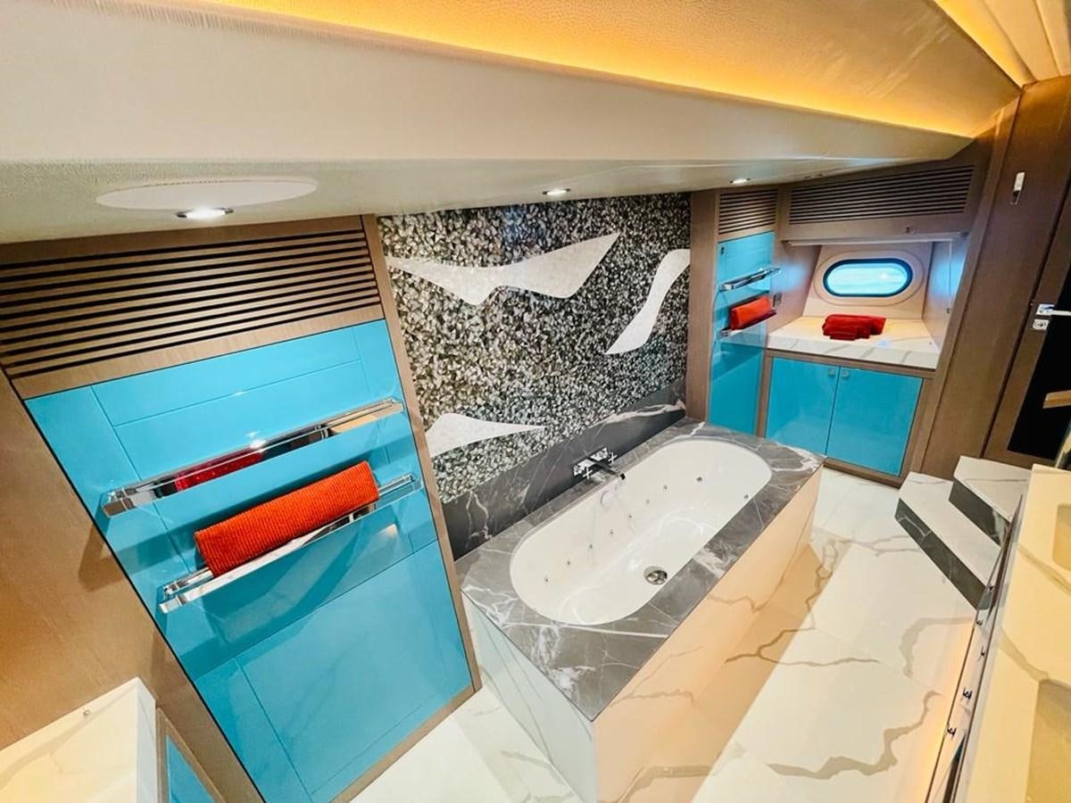 a bathroom with a tub and sink aboard SKYE Yacht for Sale