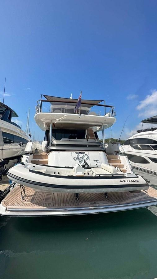 a boat docked at a pier aboard LORP Yacht for Sale
