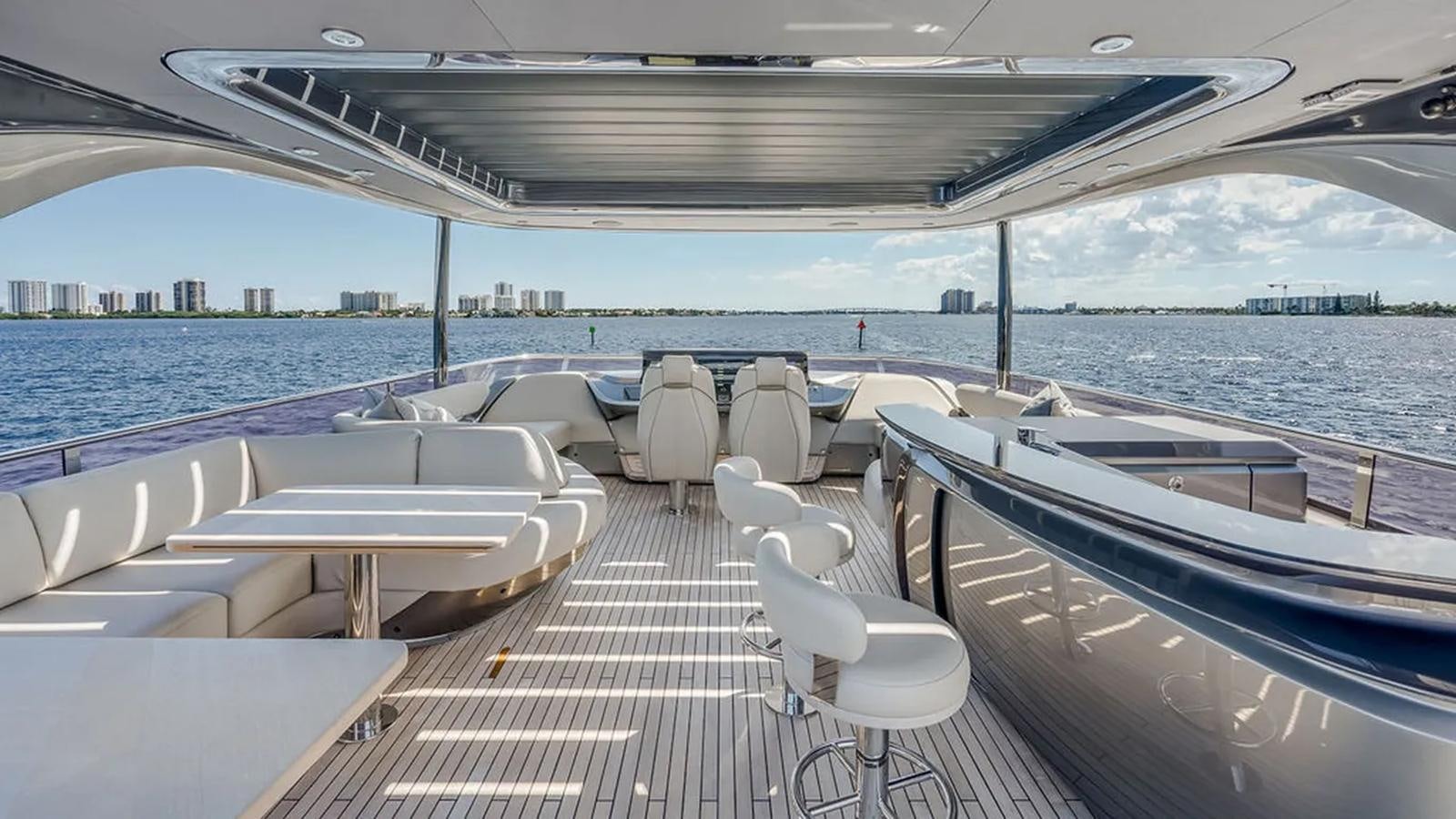 a deck with chairs and tables on it aboard LORP Yacht for Sale