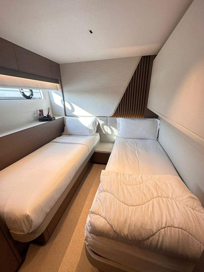 a room with a bed and a couch aboard LORP Yacht for Sale
