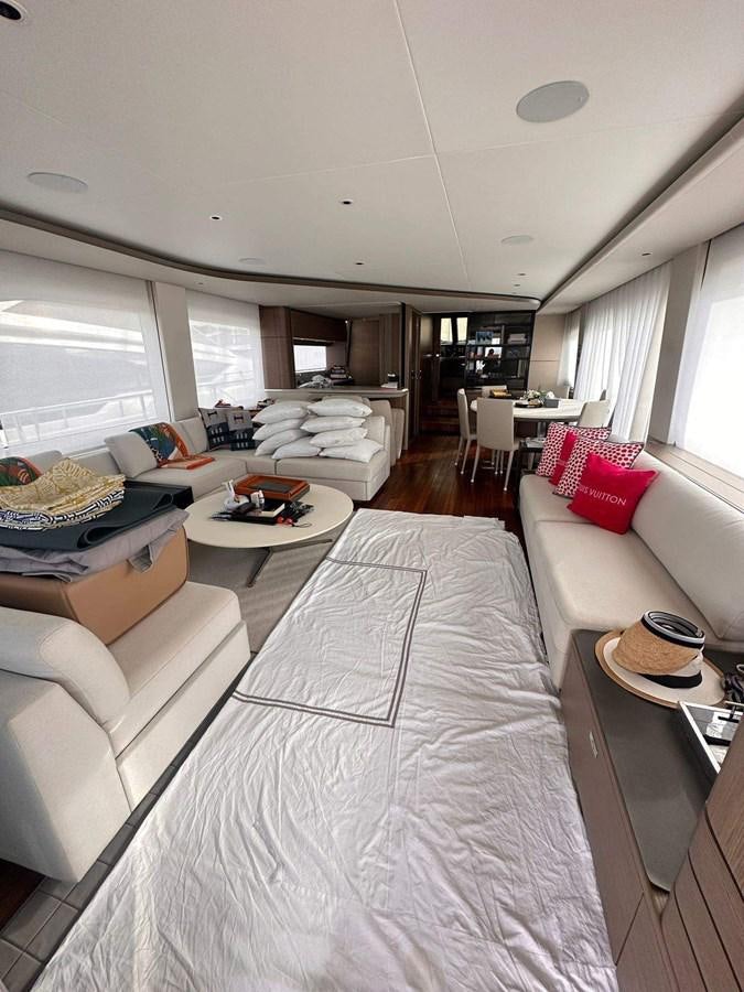a large white bedroom with a large bed and a table aboard LORP Yacht for Sale