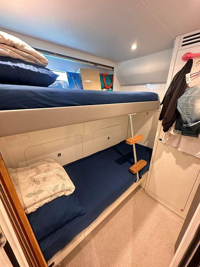 a bed with a pillow and a pillow on it aboard LORP Yacht for Sale