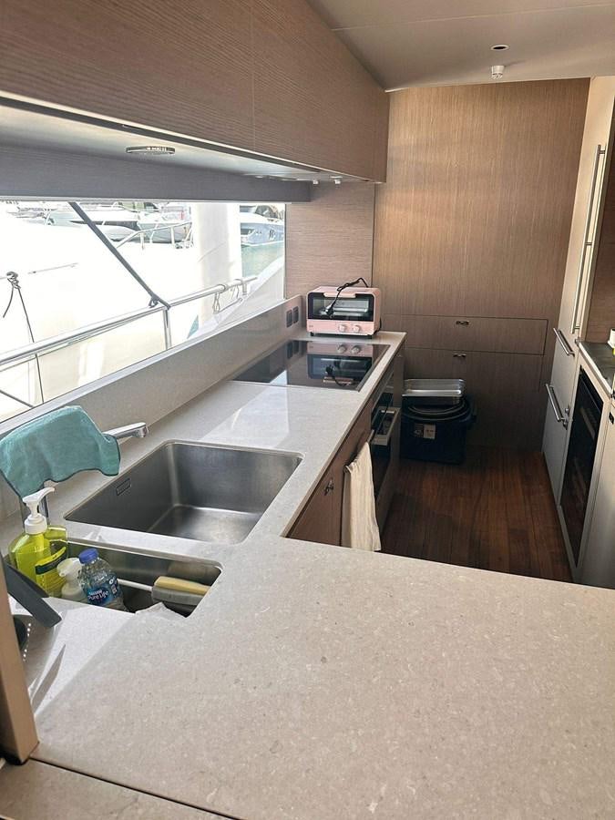 a kitchen with a sink and a window aboard LORP Yacht for Sale