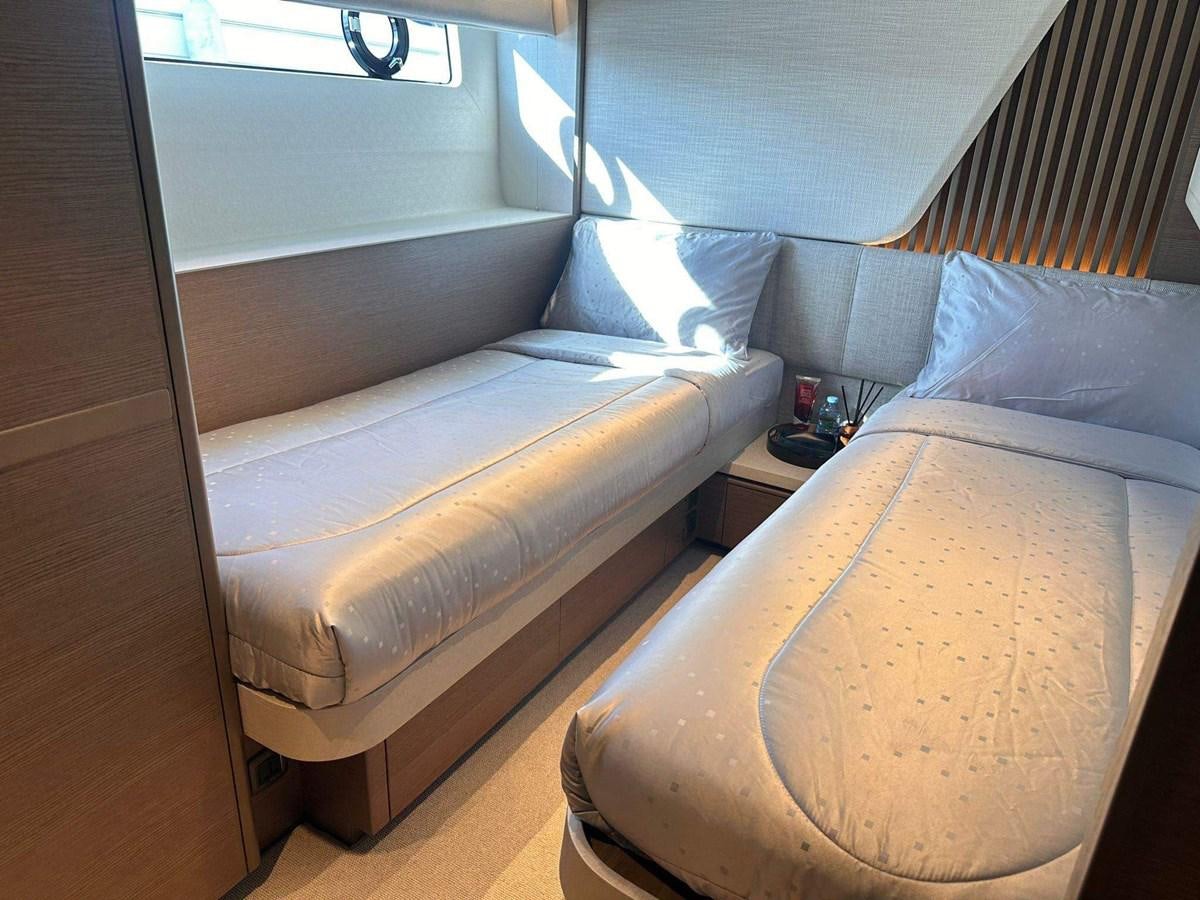 a couple of beds in a room aboard LORP Yacht for Sale