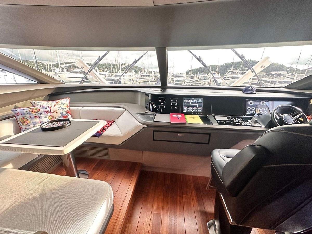 inside of a vehicle with a desk and a chair and a table with a computer on it aboard LORP Yacht for Sale