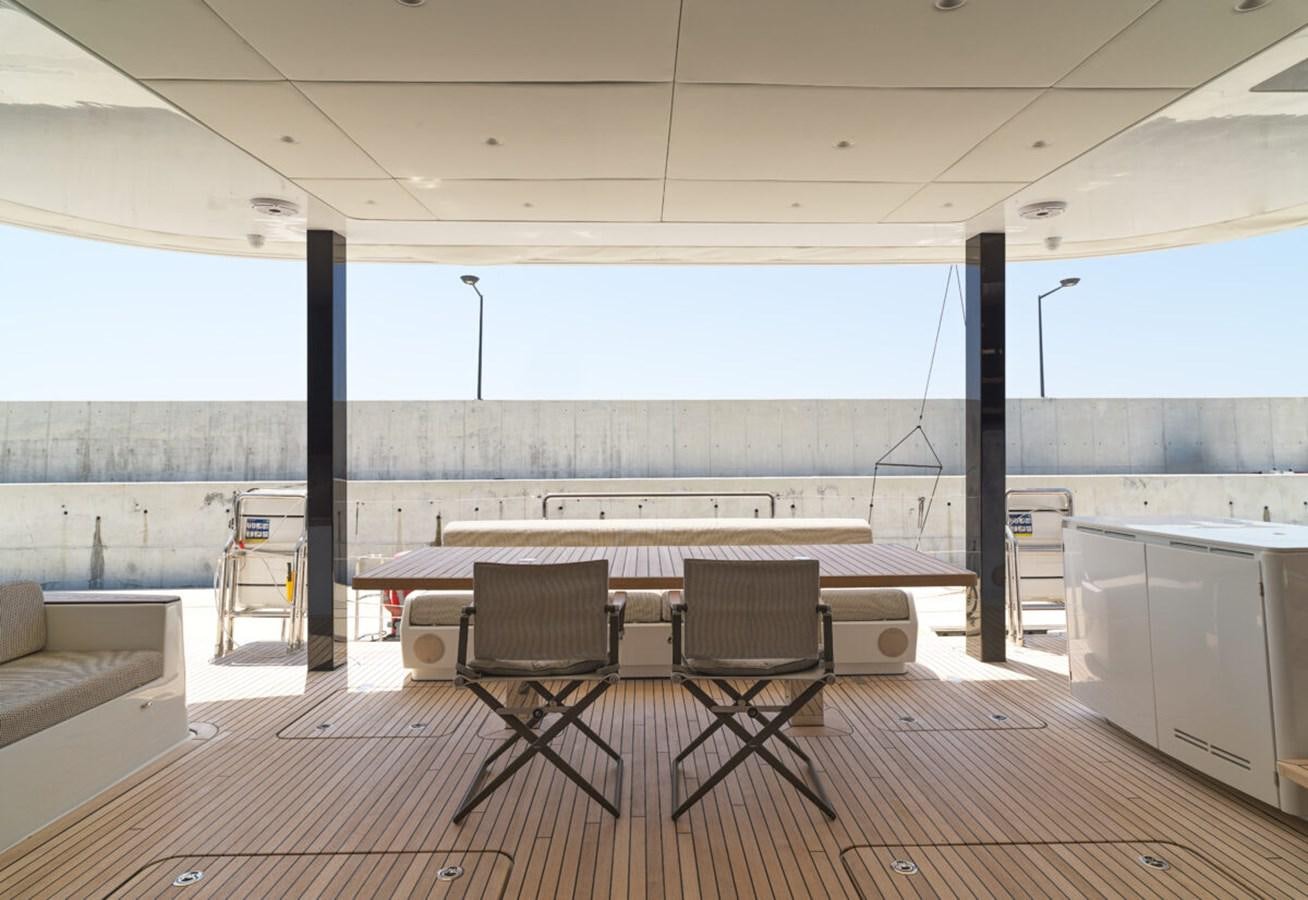 a room with a table and chairs aboard SUNREEF 70 SAIL - 2023 "OV Yacht for Sale