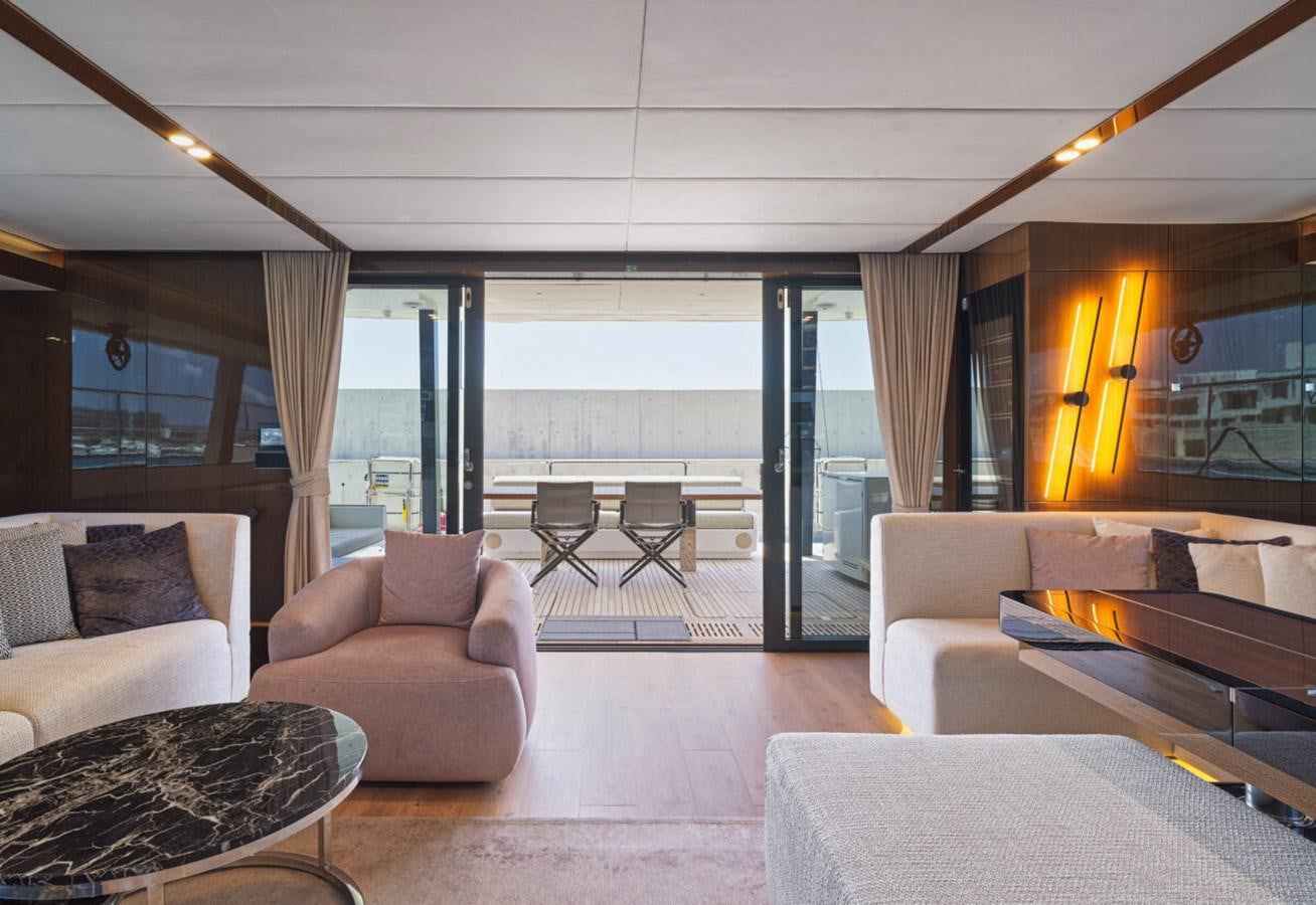a living room with a large window aboard SUNREEF 70 SAIL - 2023 "OV Yacht for Sale