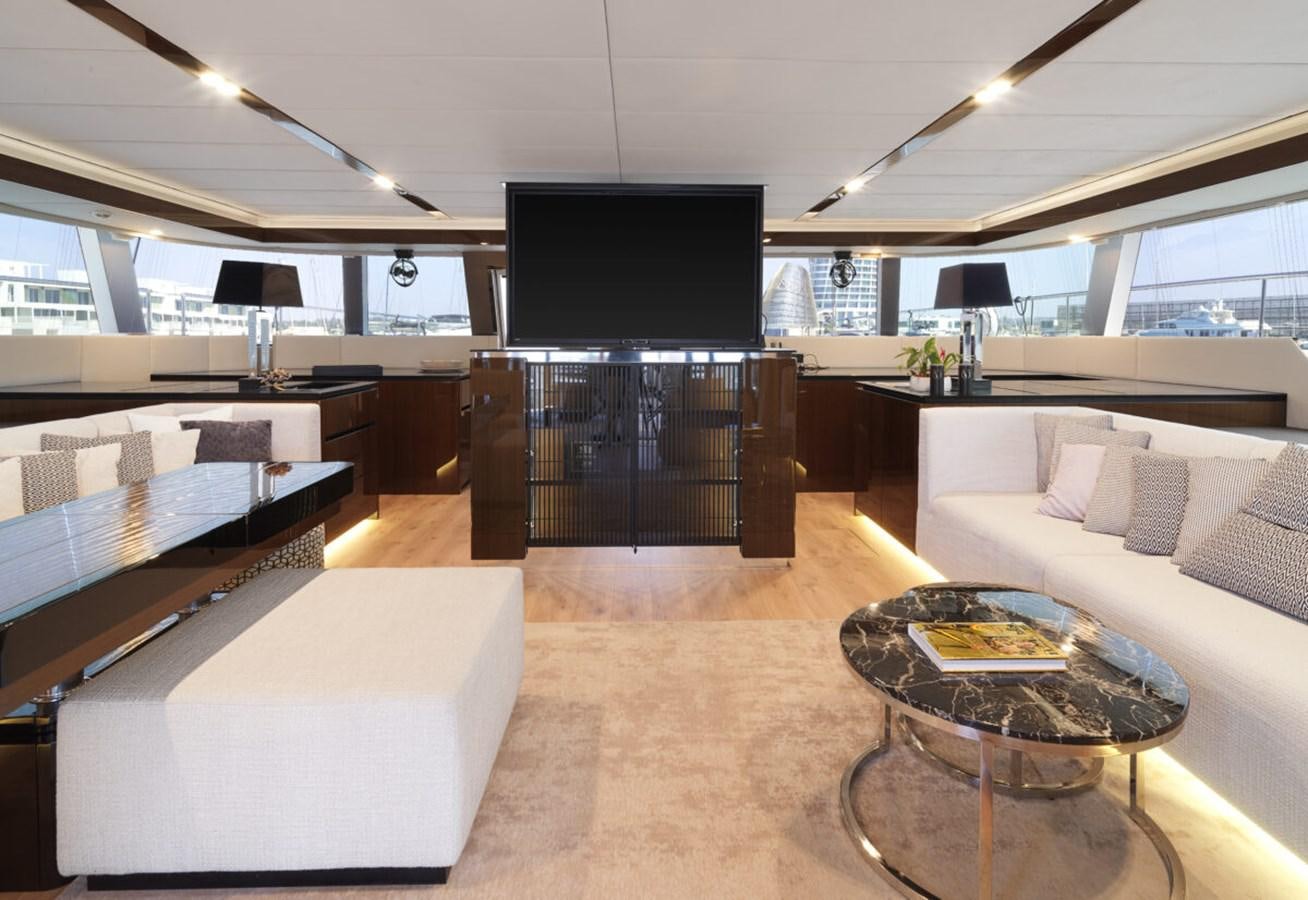 a living room with a large tv aboard SUNREEF 70 SAIL - 2023 "OV Yacht for Sale