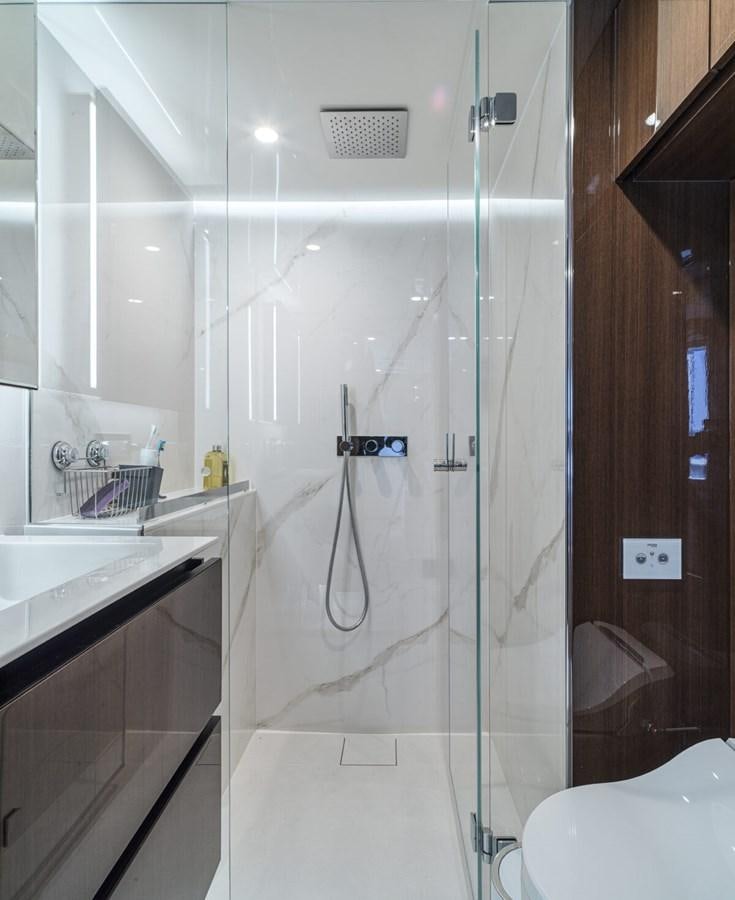 a shower with a glass door aboard SUNREEF 70 SAIL - 2023 "OV Yacht for Sale