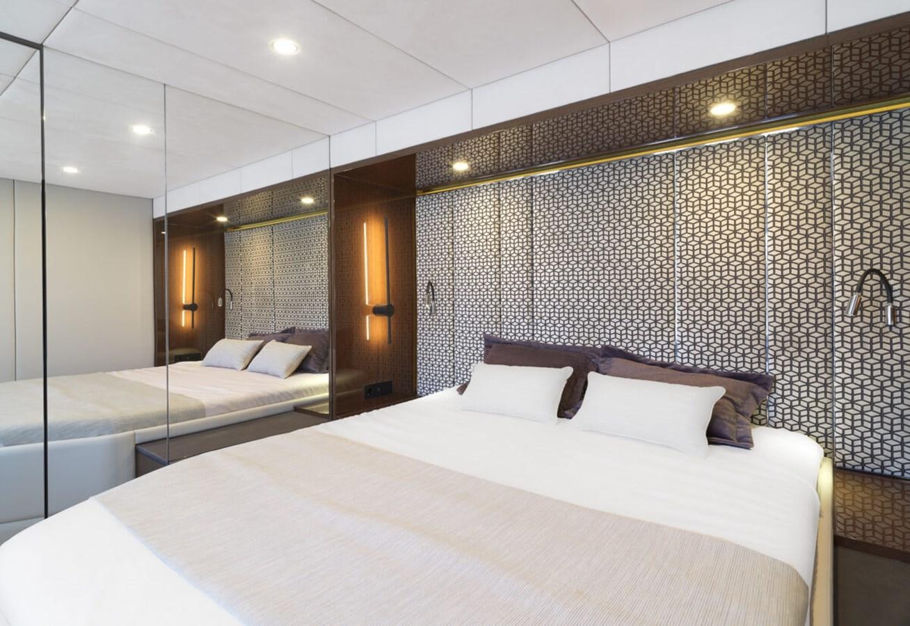 a room with two beds aboard SUNREEF 70 SAIL - 2023 "OV Yacht for Sale