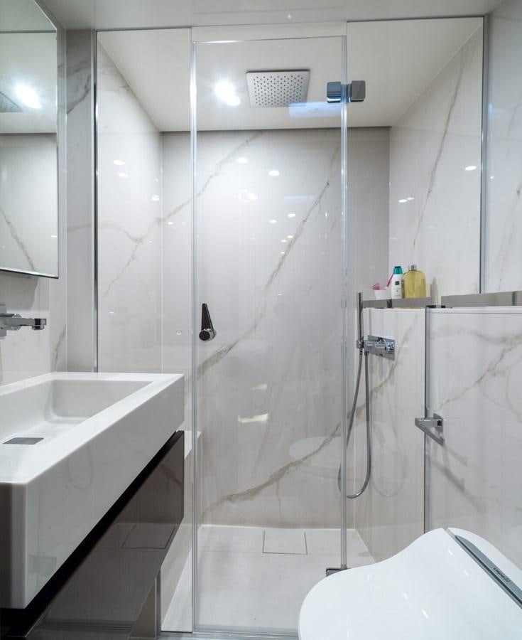 a bathroom with a shower and a sink aboard SUNREEF 70 SAIL - 2023 "OV Yacht for Sale