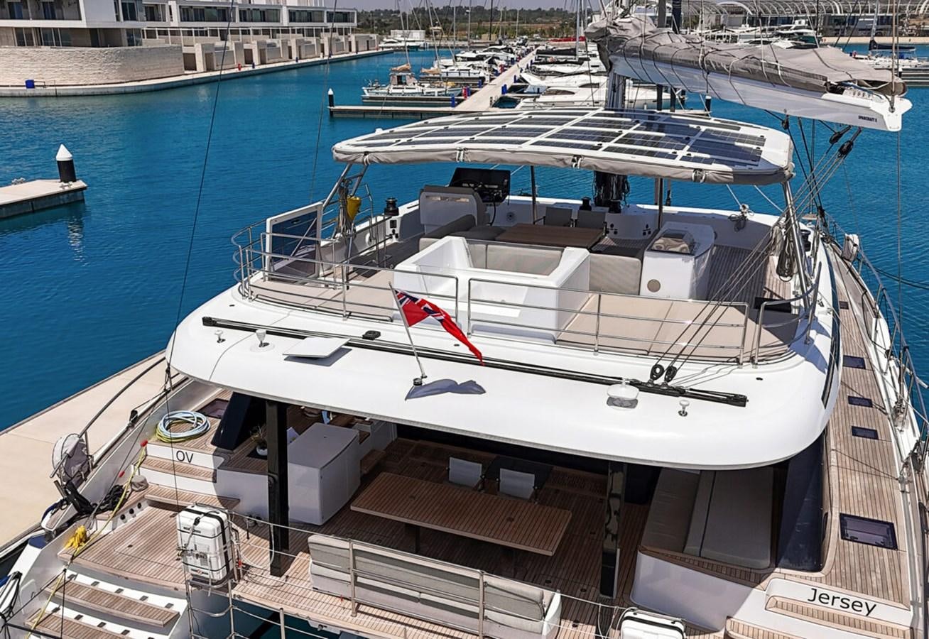 a boat docked at a pier aboard SUNREEF 70 SAIL - 2023 "OV Yacht for Sale
