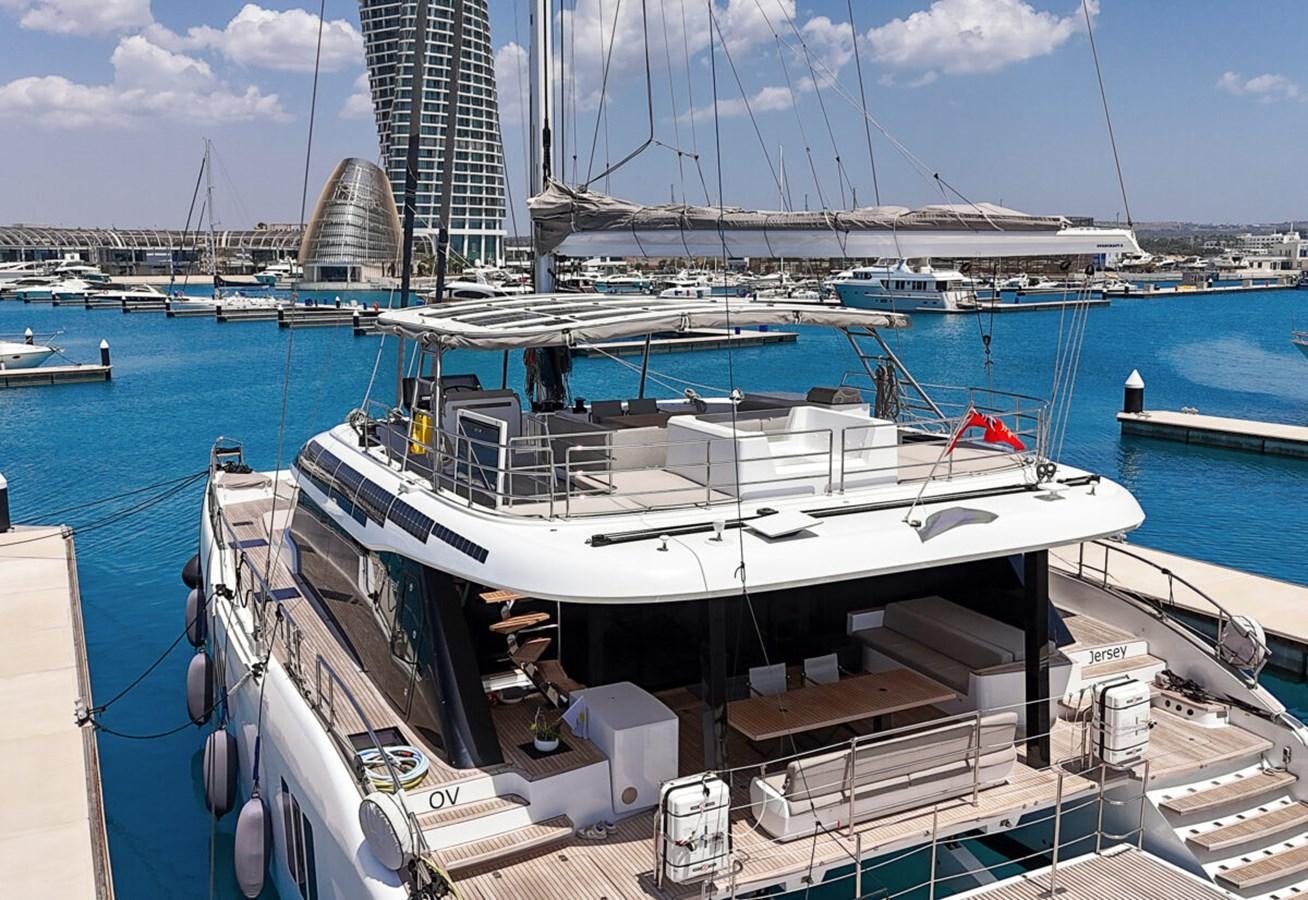 a boat docked at a pier aboard SUNREEF 70 SAIL - 2023 "OV Yacht for Sale
