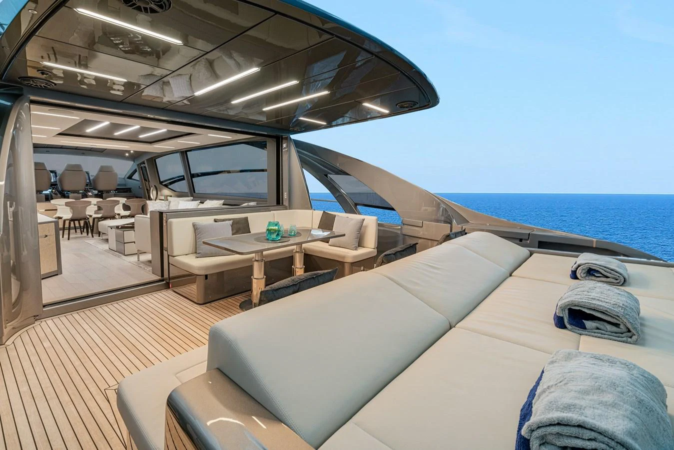 a room with a bed and a table and chairs aboard SILVER BULLET Yacht for Sale