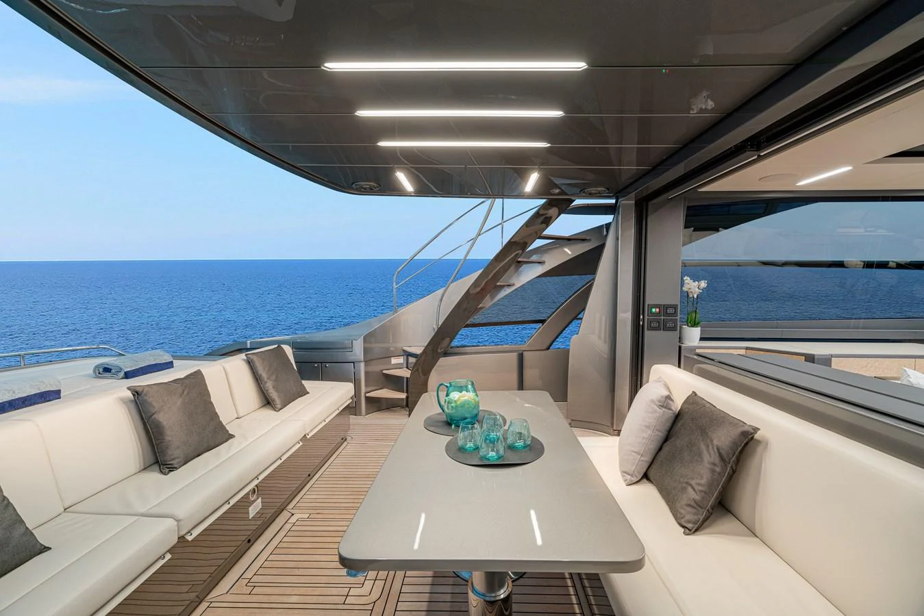 a room with a table and chairs aboard SILVER BULLET Yacht for Sale