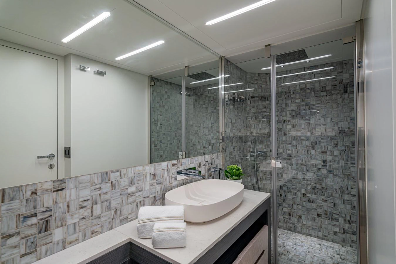 a bathroom with a large mirror aboard SILVER BULLET Yacht for Sale