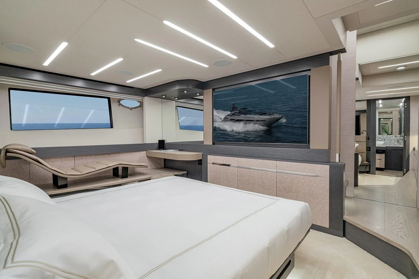 a room with a bed and a tv on the wall aboard SILVER BULLET Yacht for Sale